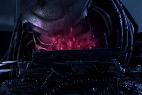 Celtic Predator studying a holographic map of the Antarctic temple in Alien vs. Predator