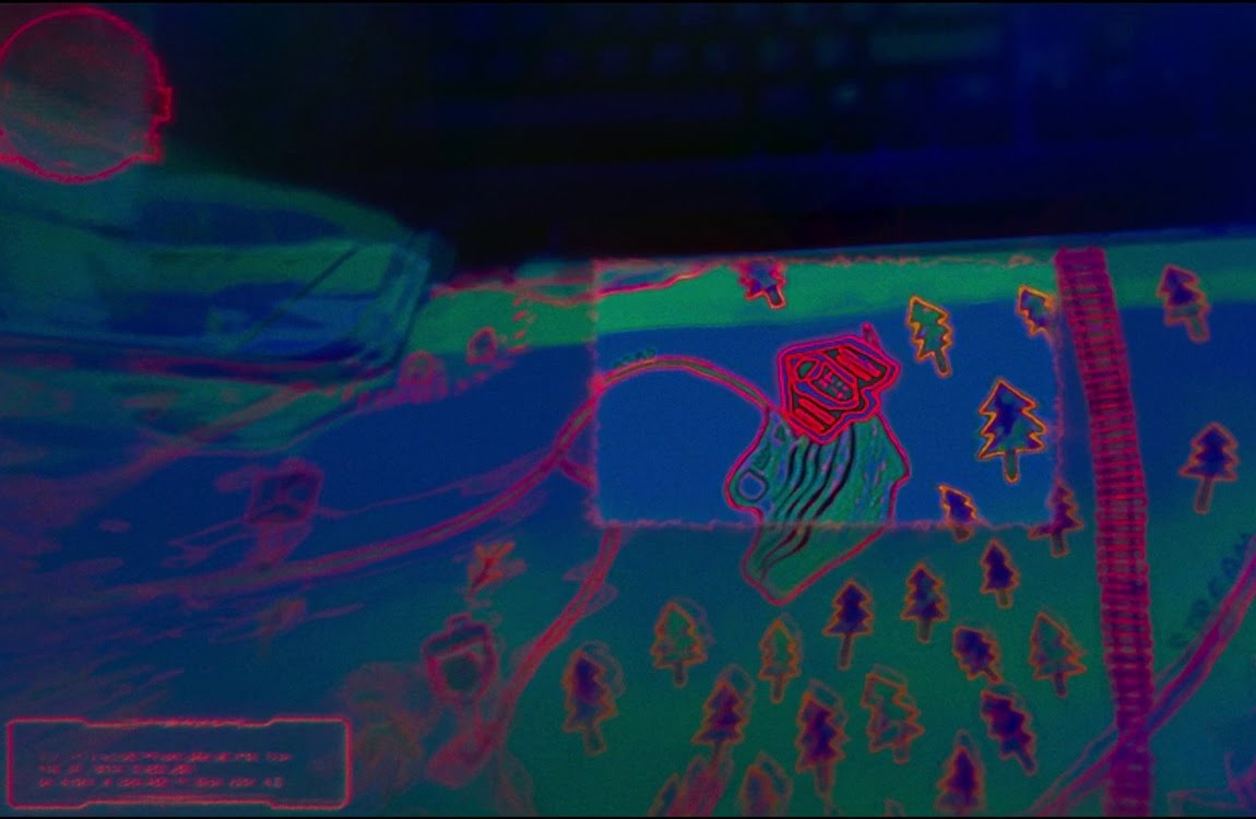 Red holographic landscape map and topographic terrain display inside a Predator ship in The Predator