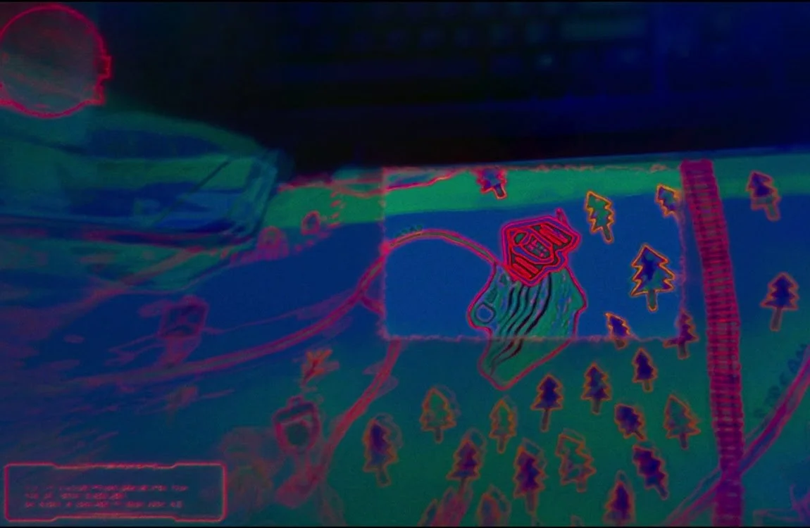 Red holographic landscape map and topographic terrain display inside a Predator ship in The Predator