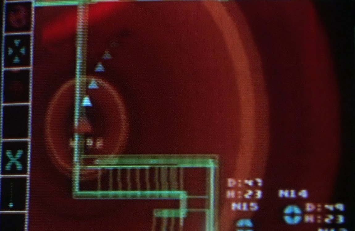 Closeup of the slaughterhouse monitor showing catwalks, stairs and target markers in Predator 2