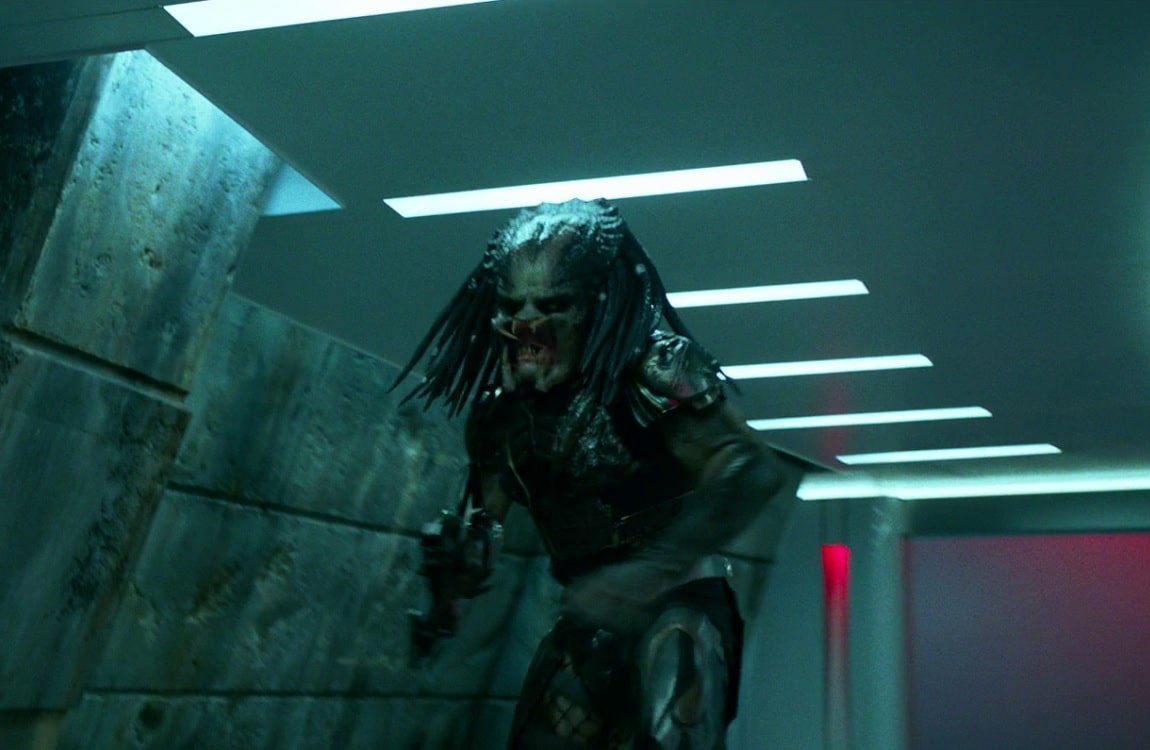 The fugitive Predator uses a human gun in The Predator