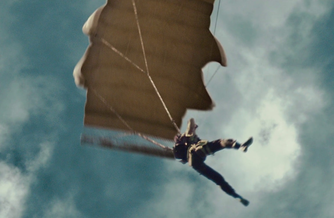 Royce being dropped by parachute on the Game Preserve planet