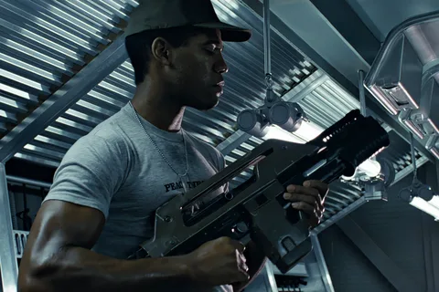 Private Frost holding an M41A Pulse Rifle aboard the USS Sulaco in Aliens