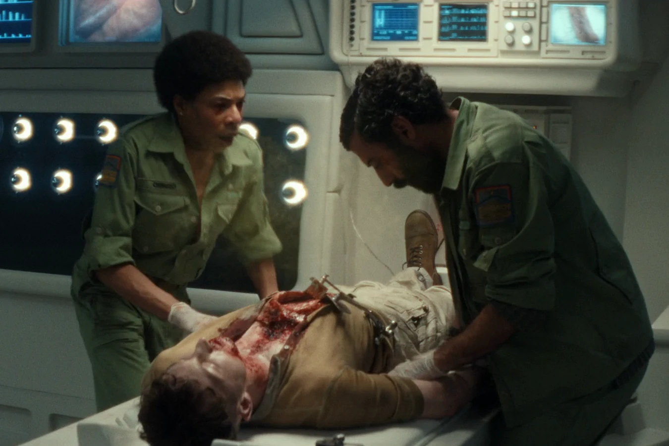 Rahim operating on Malachite with Chibuzo in the Maginot medbay in Alien: Earth