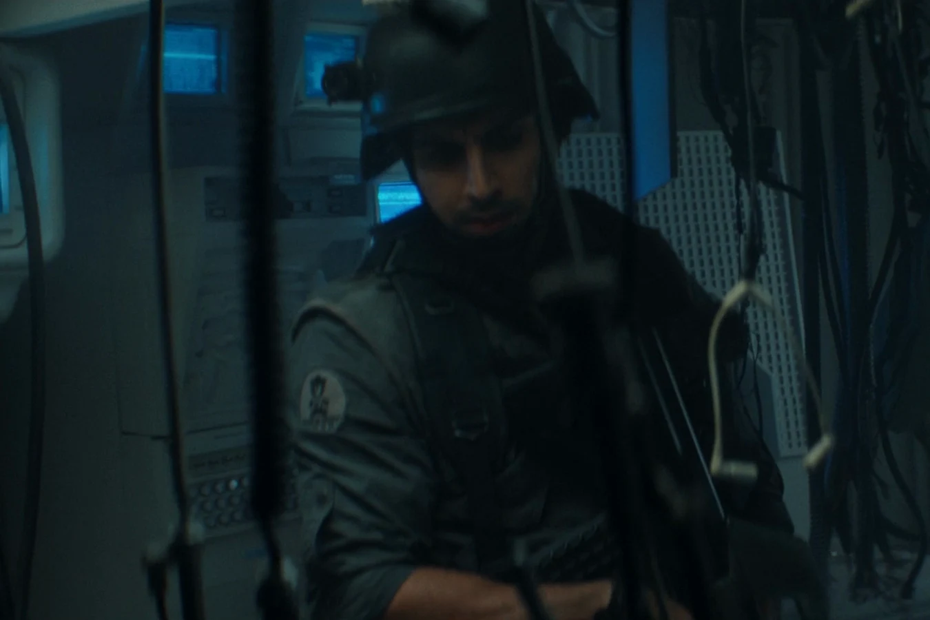 Rashidi in his tactical helmet inside the medical bay of the USCSS Maginot in Alien: Earth