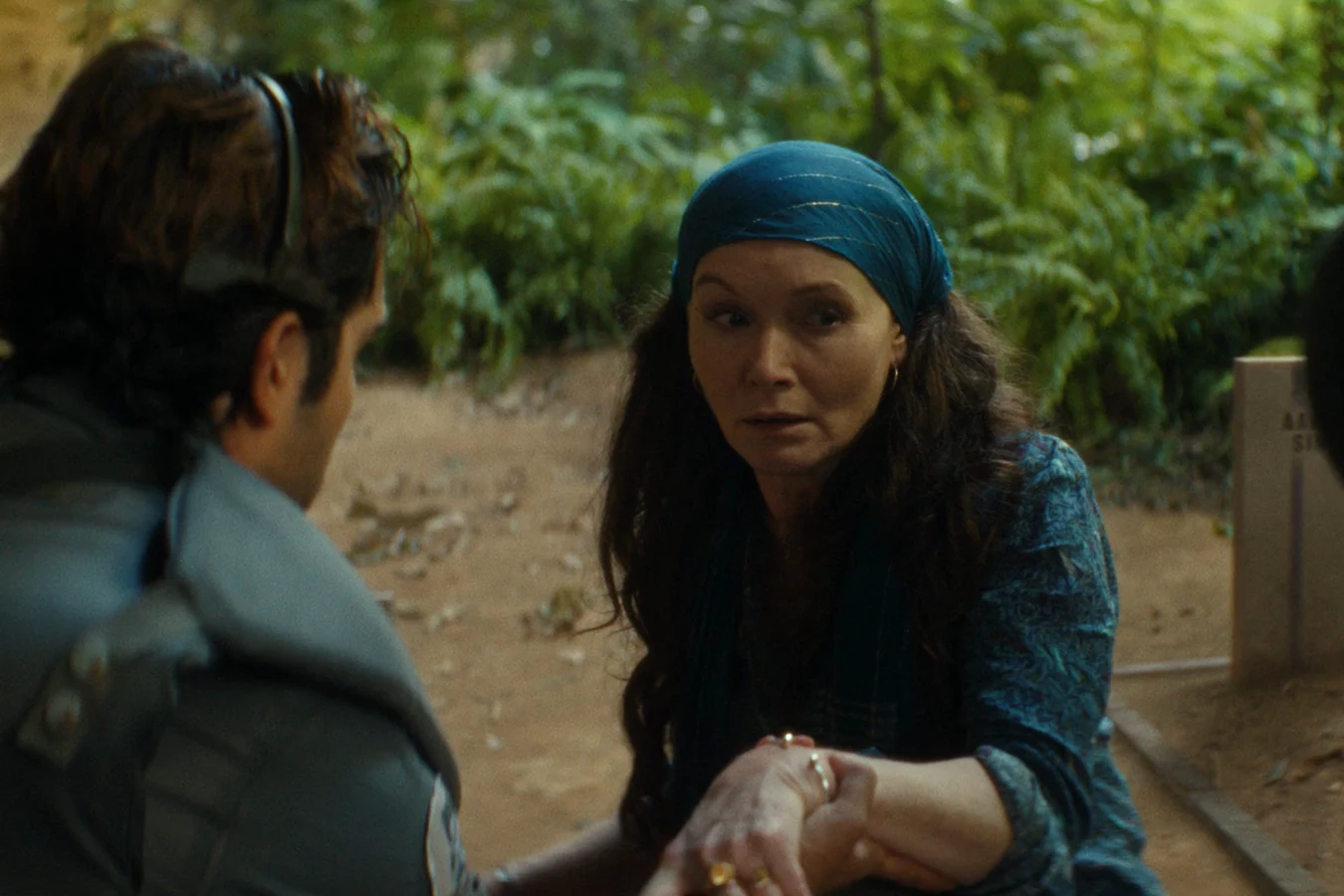 Rashidi reaching Dame Sylvia in the Neverland jungle during the lockdown in Alien: Earth