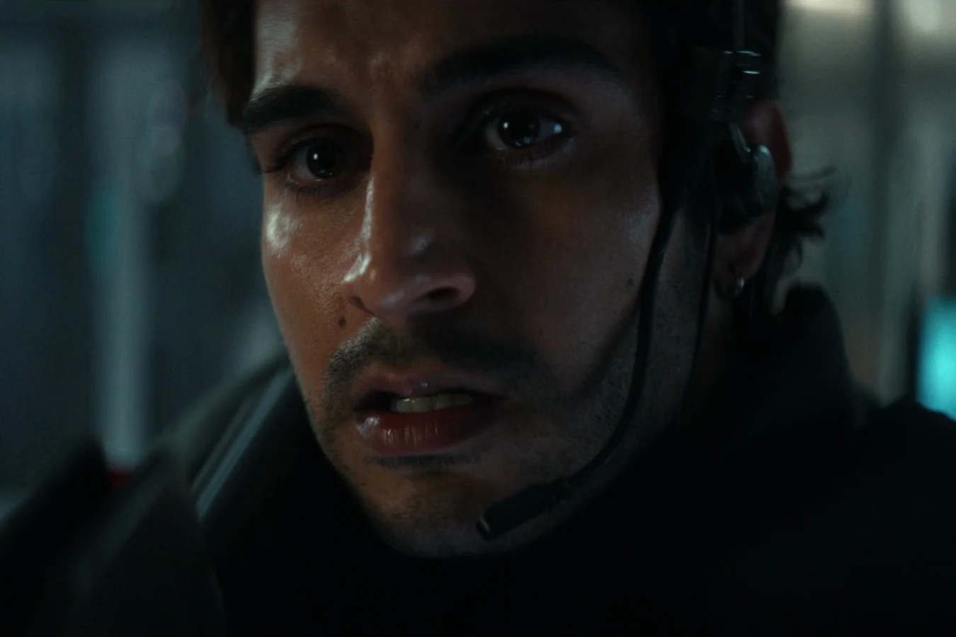 Rashidi looking up in horror inside a darkened Neverland laboratory in Alien: Earth