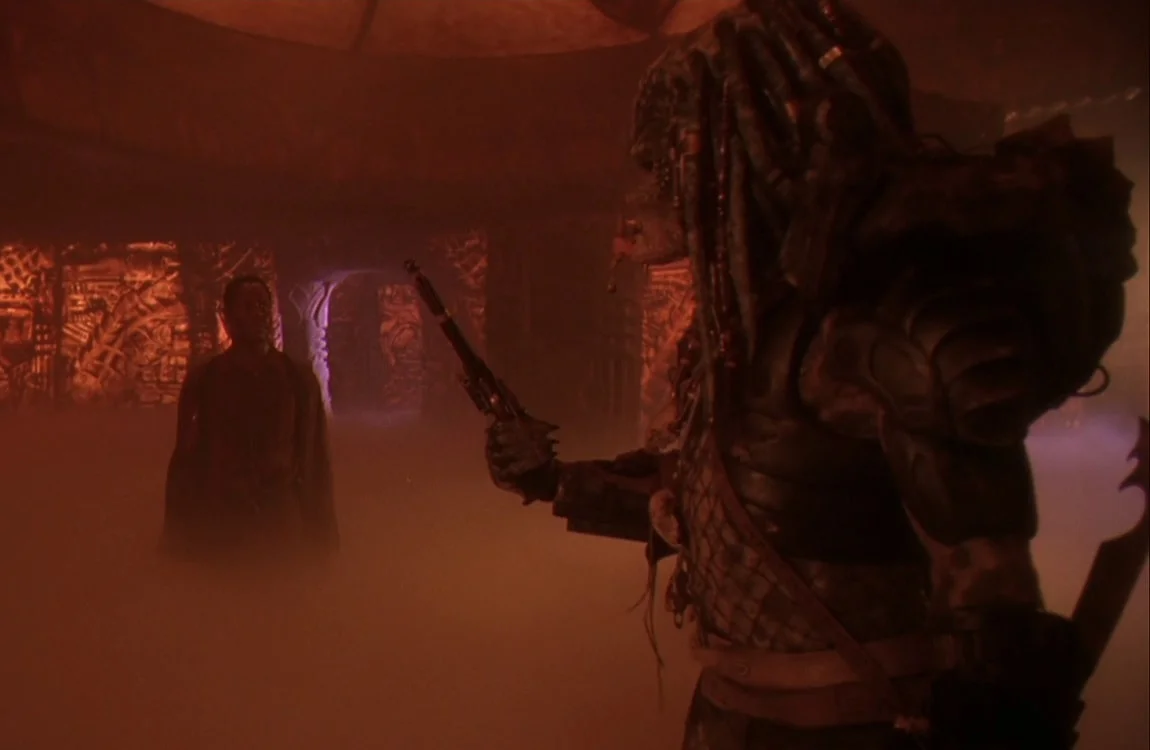 Harrigan is given the flintlock pistol by Greyback Predator