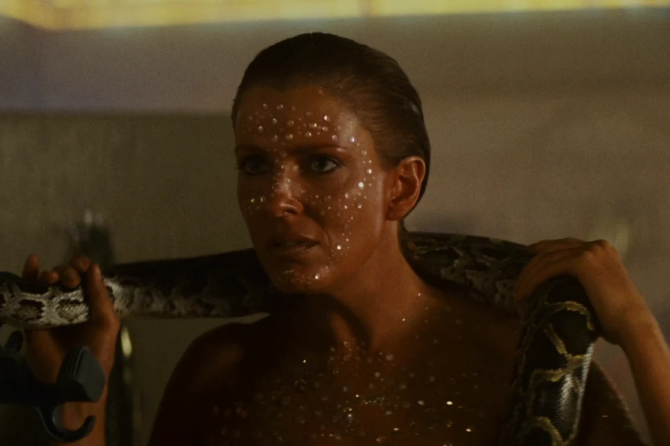 Zhora holding her snake in the dressing room in Blade Runner
