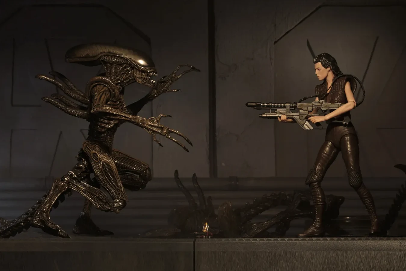 NECA Ripley 8 action figure facing a Resurrection Xenomorph