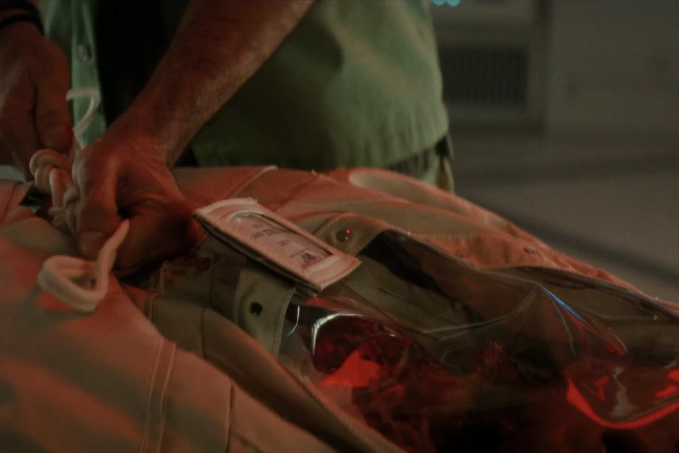 Dinsdale's body bag being prepared for burial in space aboard the Maginot in Alien: Earth