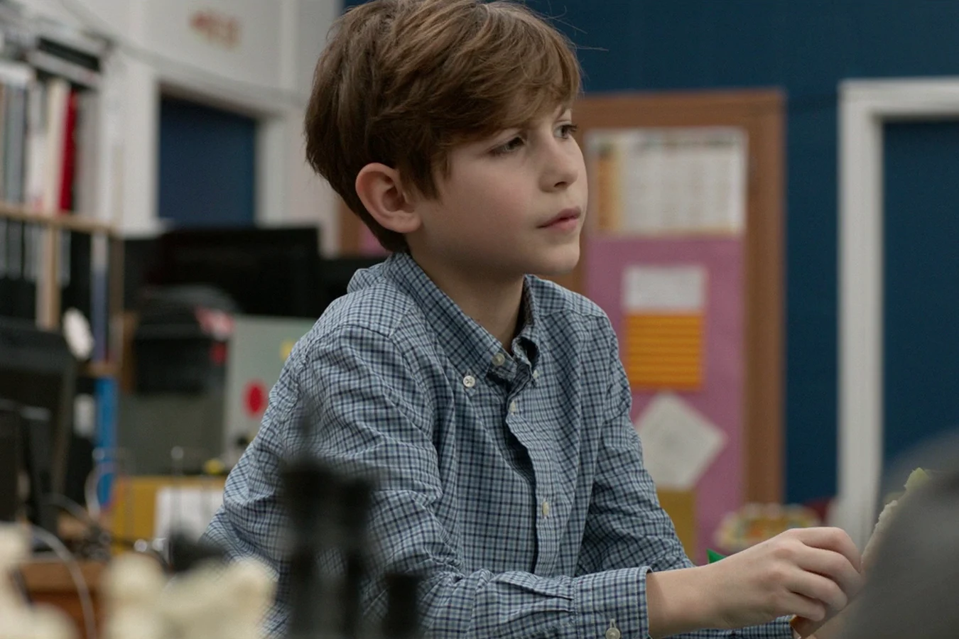 Rory McKenna sitting at a classroom desk in Lawrence A. Gordon Middle School