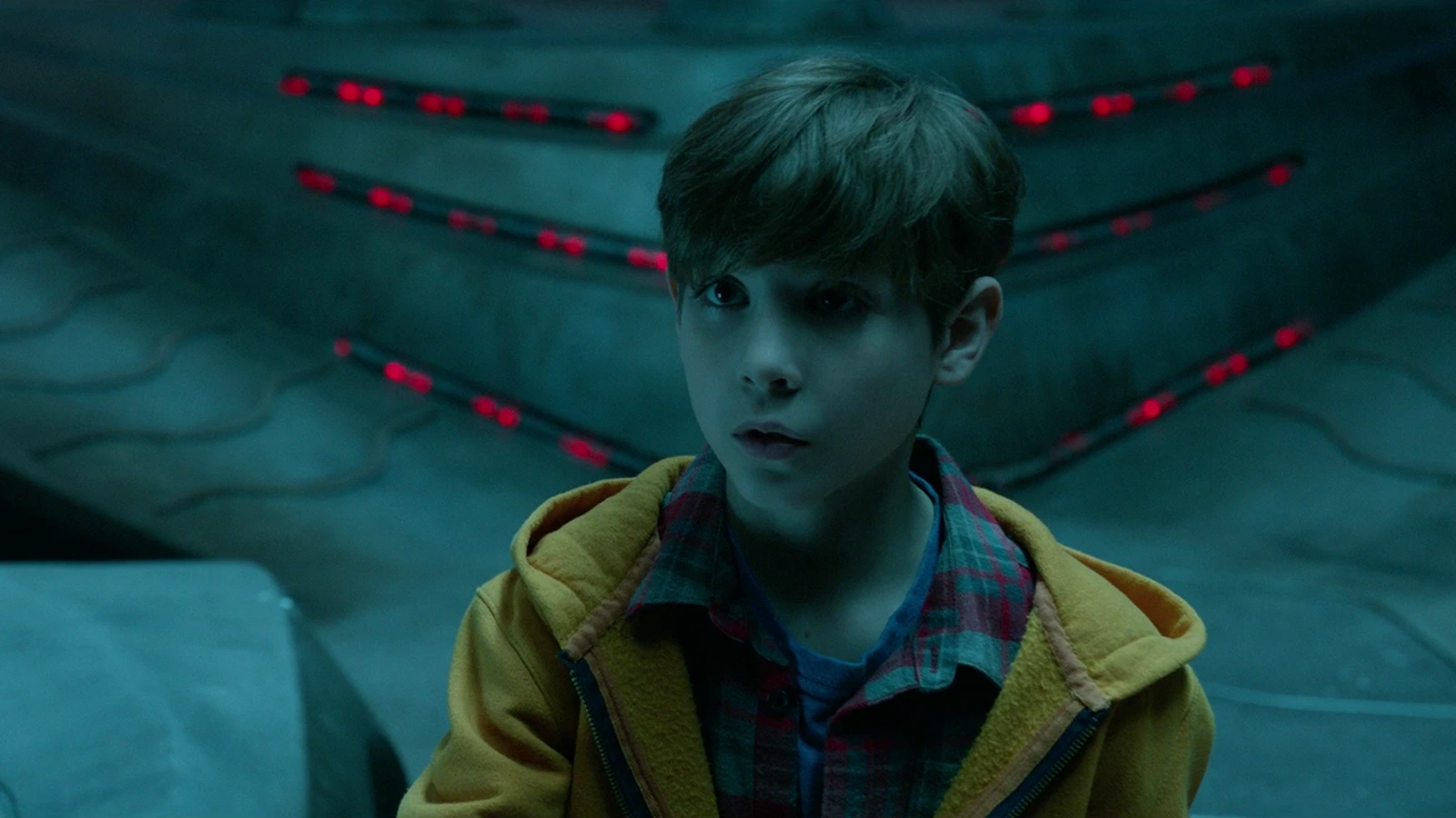 Rory McKenna in a school hallway looking toward the camera during The Predator