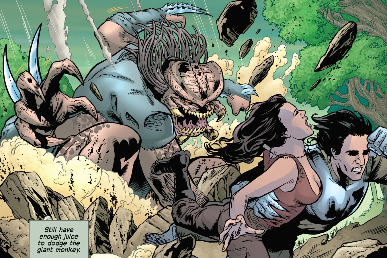 Royce, wearing Predator armor, carrying Isabelle away from a huge four-armed Predator as rocks fly around them