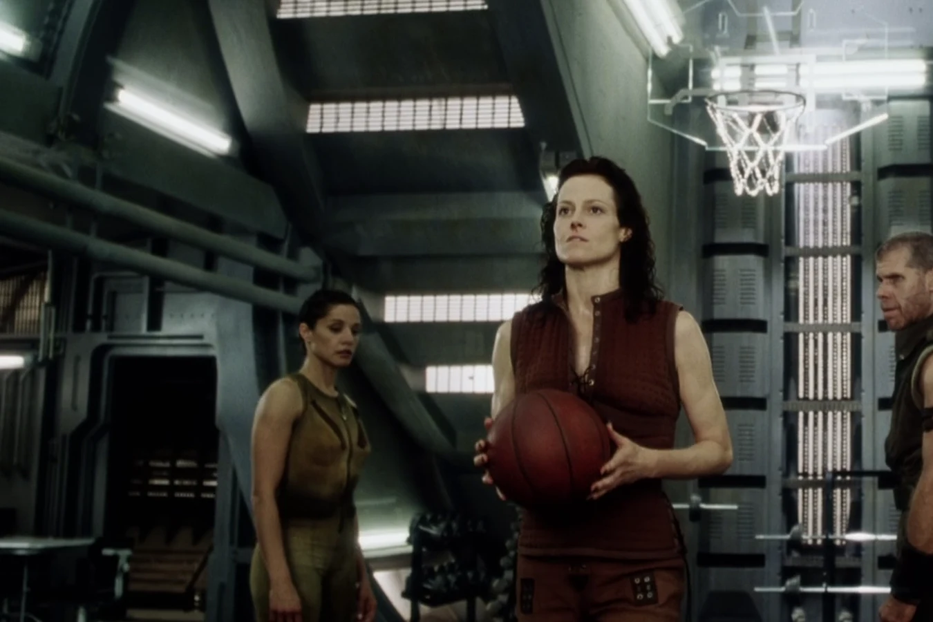 Hillard watching the basketball game in the Auriga mess hall gym