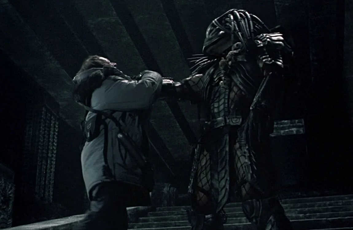 Scar Predator about to kill Charles Bishop Weyland