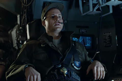 Lieutenant Scott Gorman in a Colonial Marines cap and headset at the APC console in Aliens