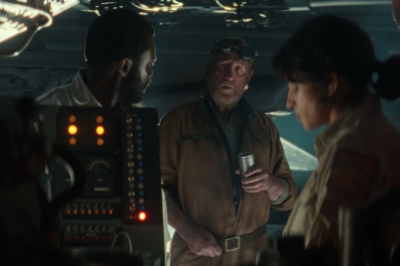 Shmuel in his engineer jumpsuit and headlamp goggles talking during the Maginot fuel crisis in Alien: Earth