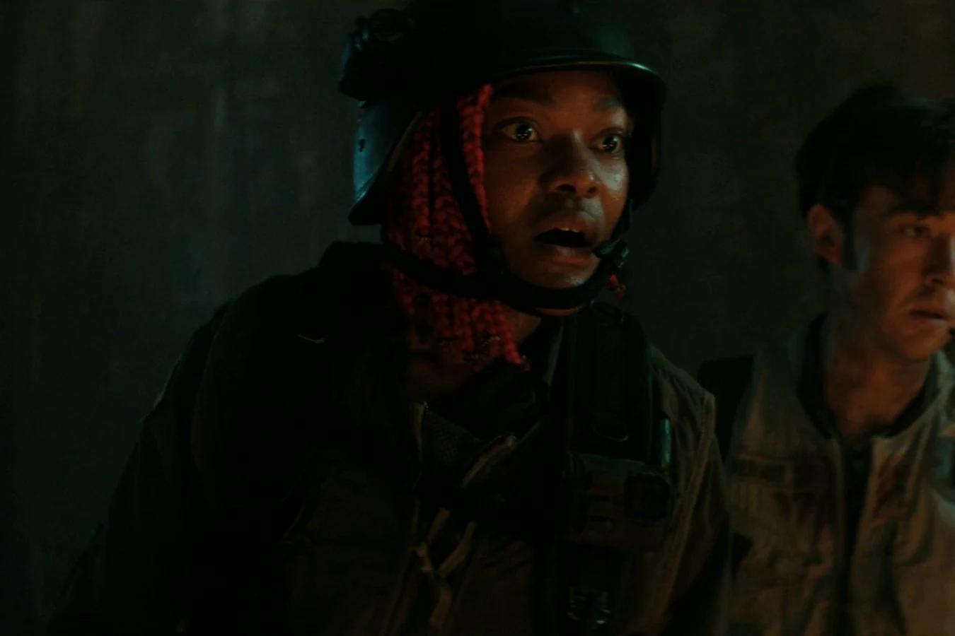 Siberian in her tactical helmet beside Joe Hermit inside the wrecked tower in Alien: Earth