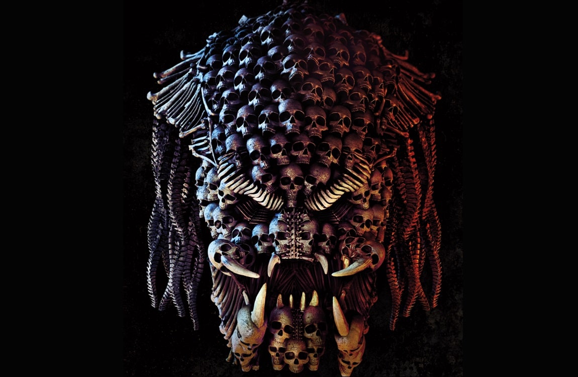 The Poster for the Predator, showing a Predator head formed by skulls