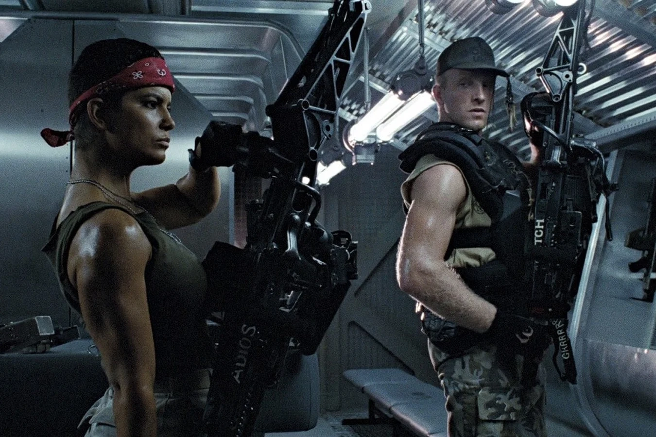Vasquez and Drake with M56 Smartguns, ADIOS marking visible on Vasquez's gun