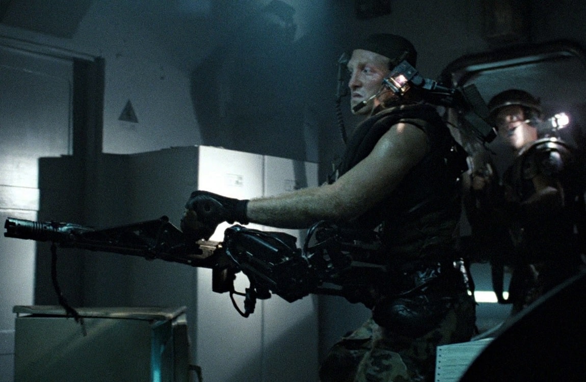 Private First Class Mark Drake using a smartgun in Aliens