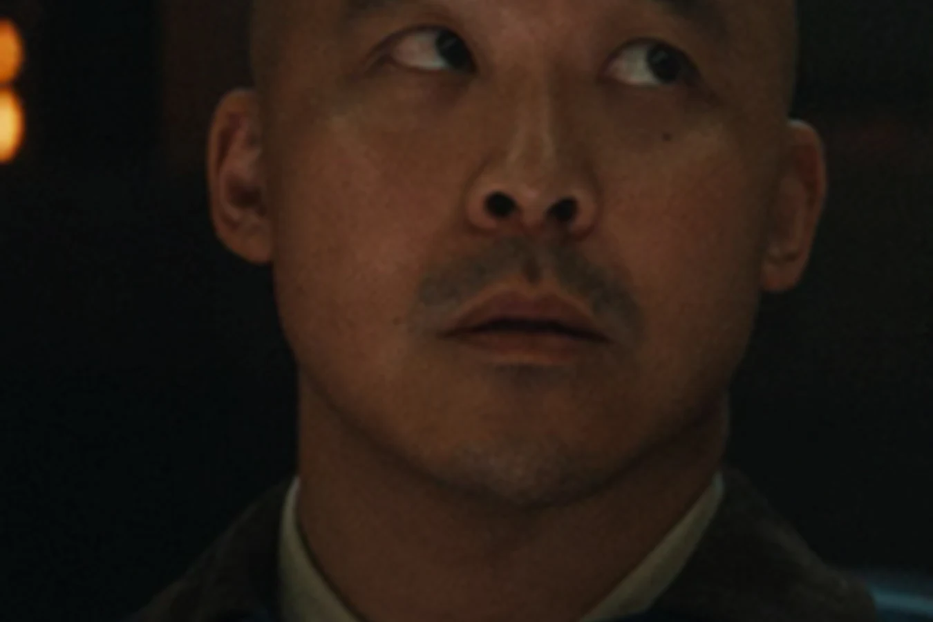 Close-up of Teng in his Maginot navigator uniform in Alien: Earth