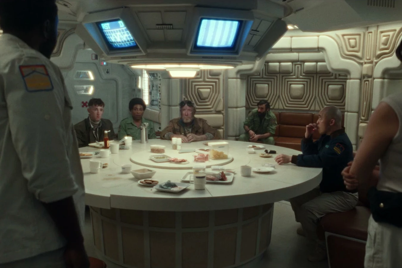 Teng seated at the Maginot mess hall briefing table in Alien: Earth