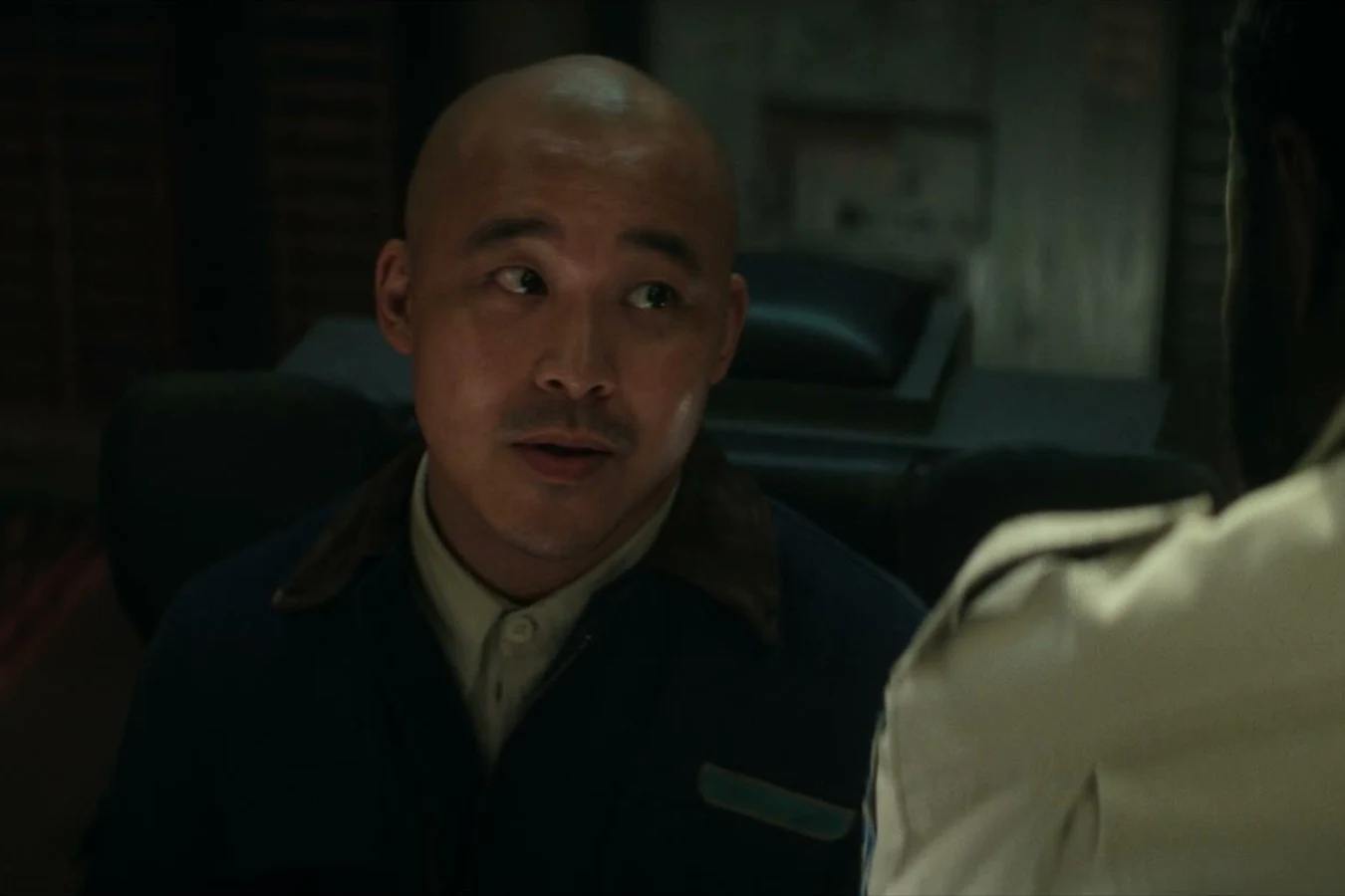 Teng speaking during a Maginot crisis exchange in Alien: Earth