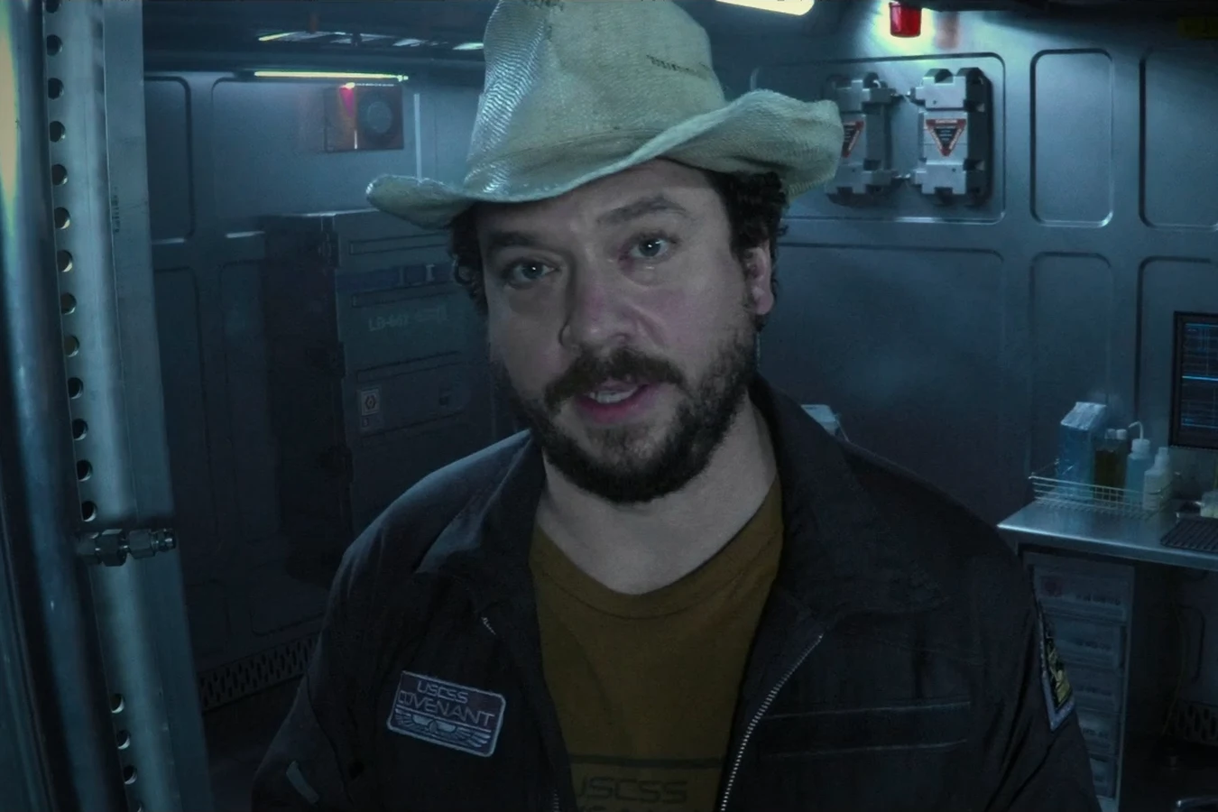 Tennessee in his cowboy hat recording a video message in a room aboard the Covenant