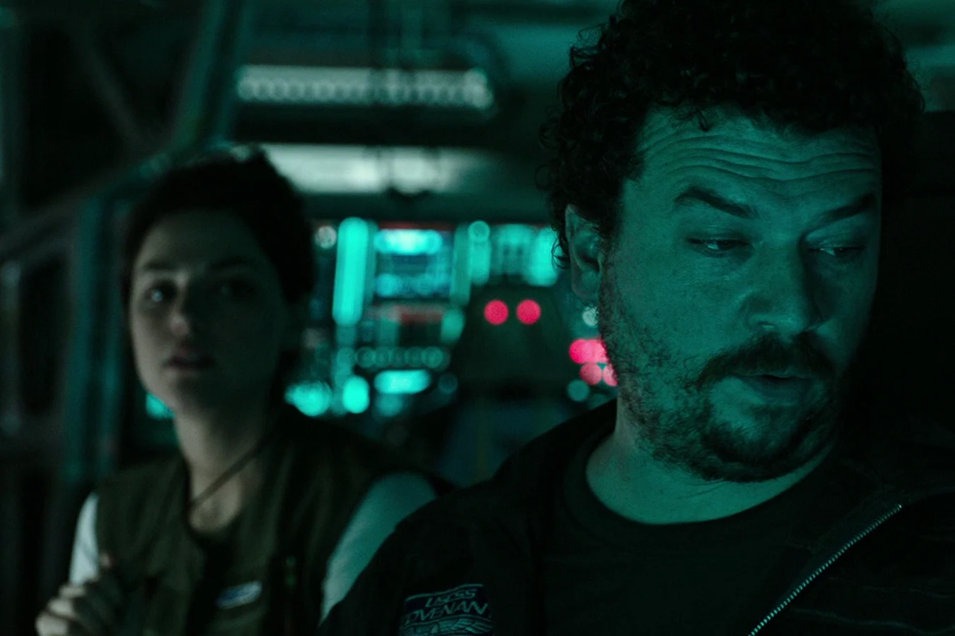 Tennessee at his station with a female crewmate seated behind him