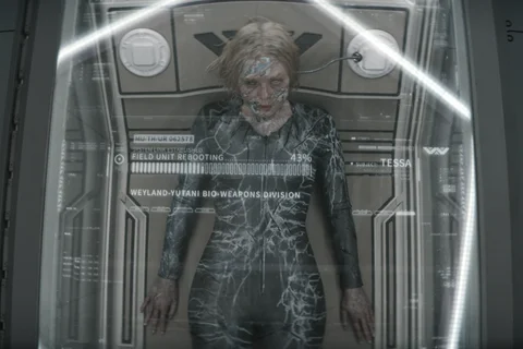 Tessa rebooting in a Weyland-Yutani repair capsule from Predator: Badlands
