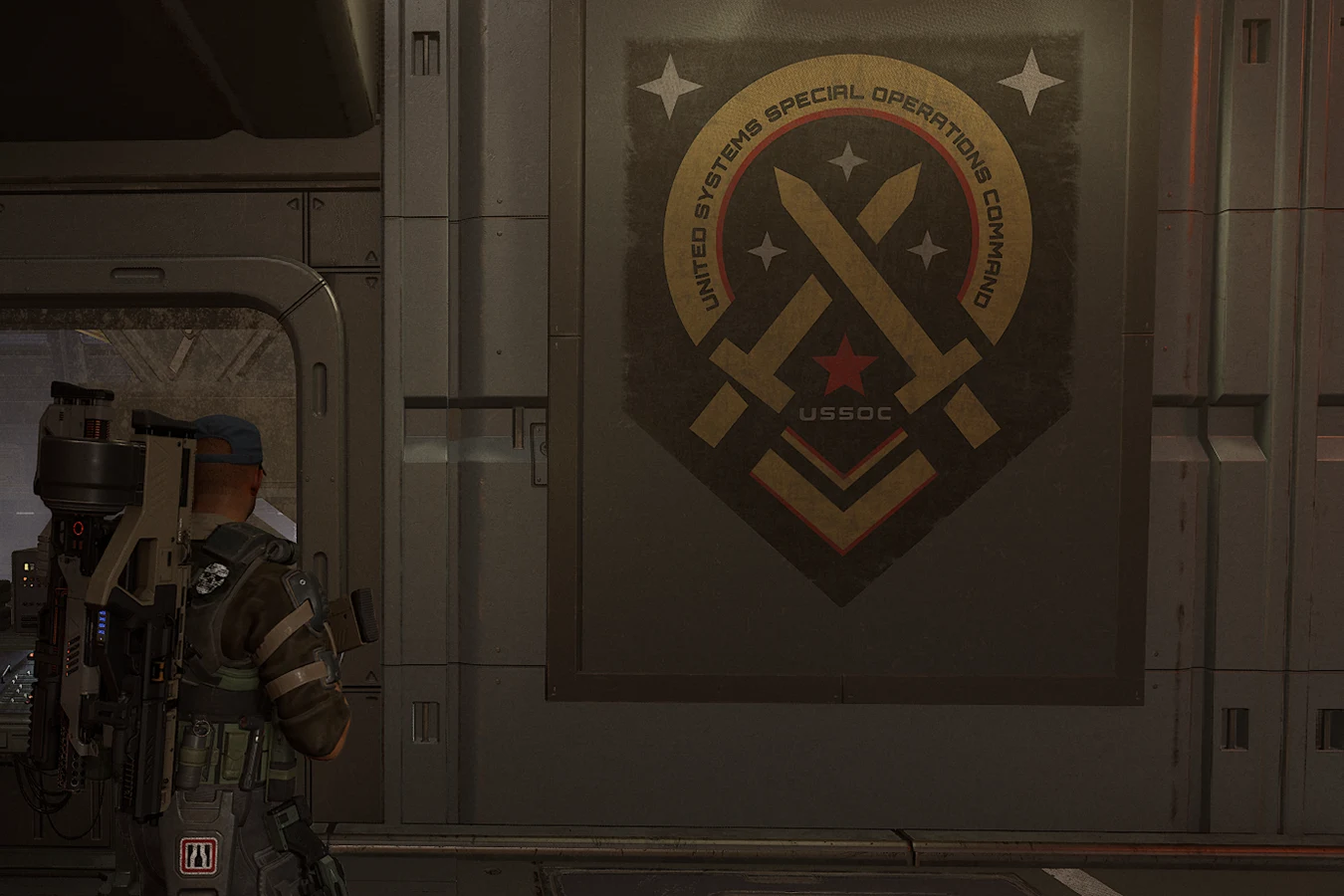 A marine facing a United Systems Special Operations Command plaque in Aliens: Fireteam Elite 2