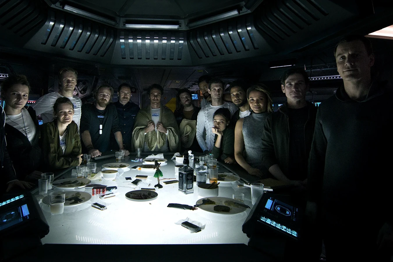Walter standing apart from the Covenant crew at their last meal before hypersleep