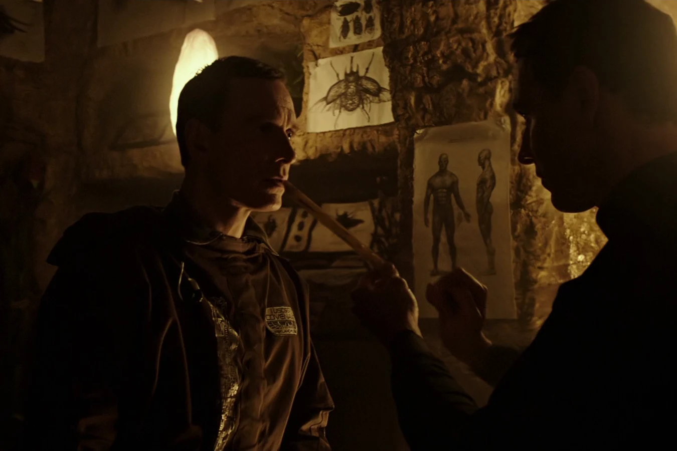 Walter facing David as David holds a flute in the Engineer city on Alien: Covenant