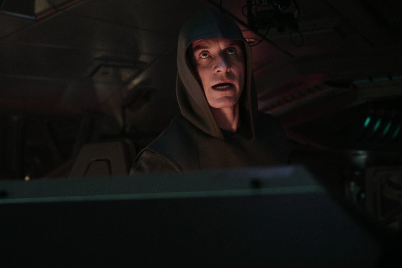 Walter in a hood at a console on the Covenant during the particle burst