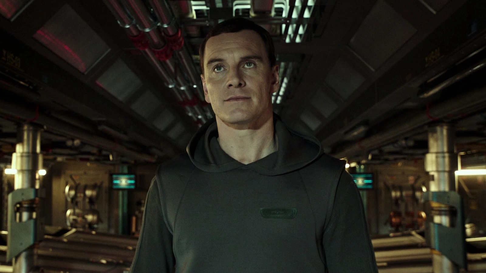 Walter in a hooded suit in a corridor of the USCSS Covenant