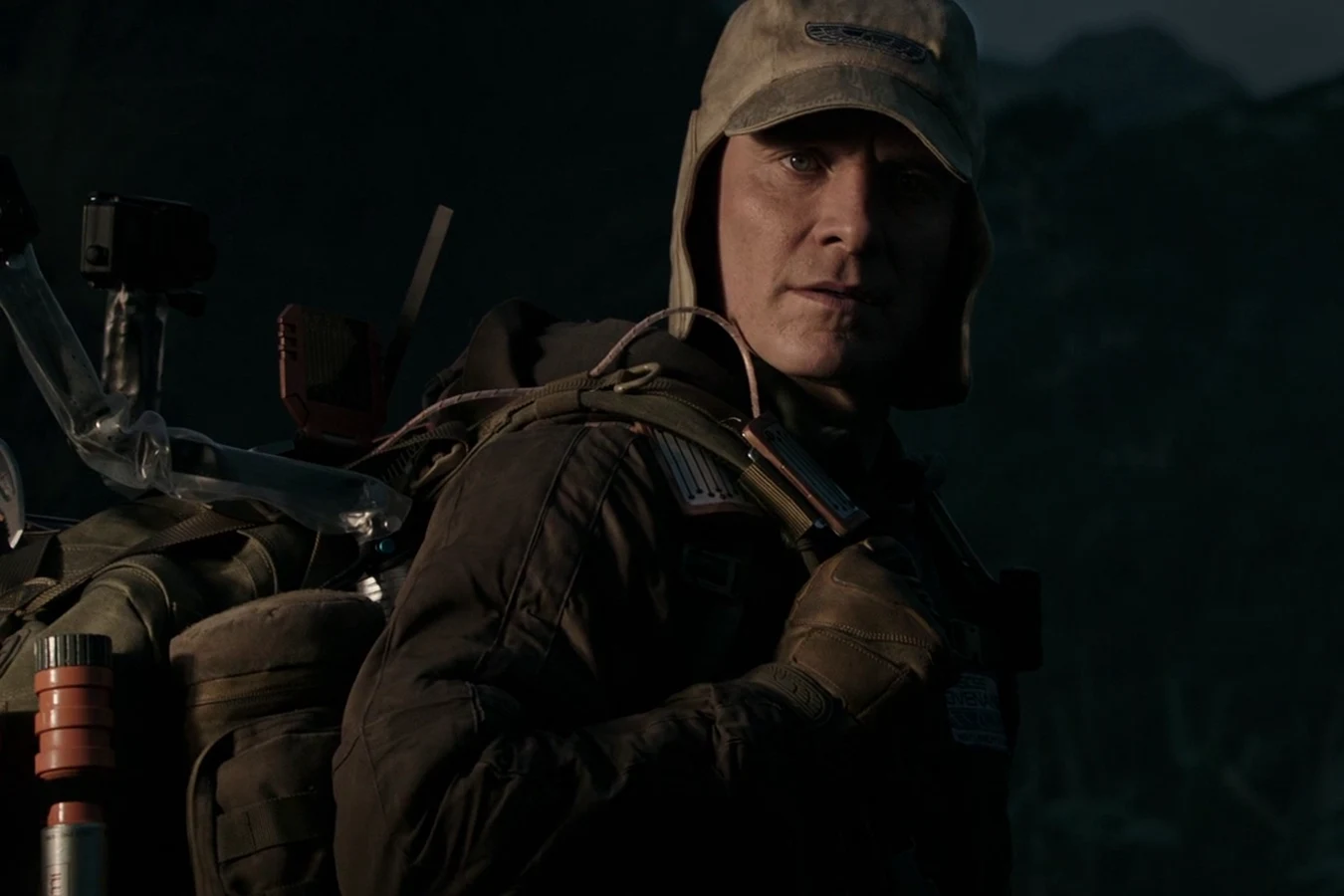 Walter in expedition gear with a pack on the surface of Planet 4