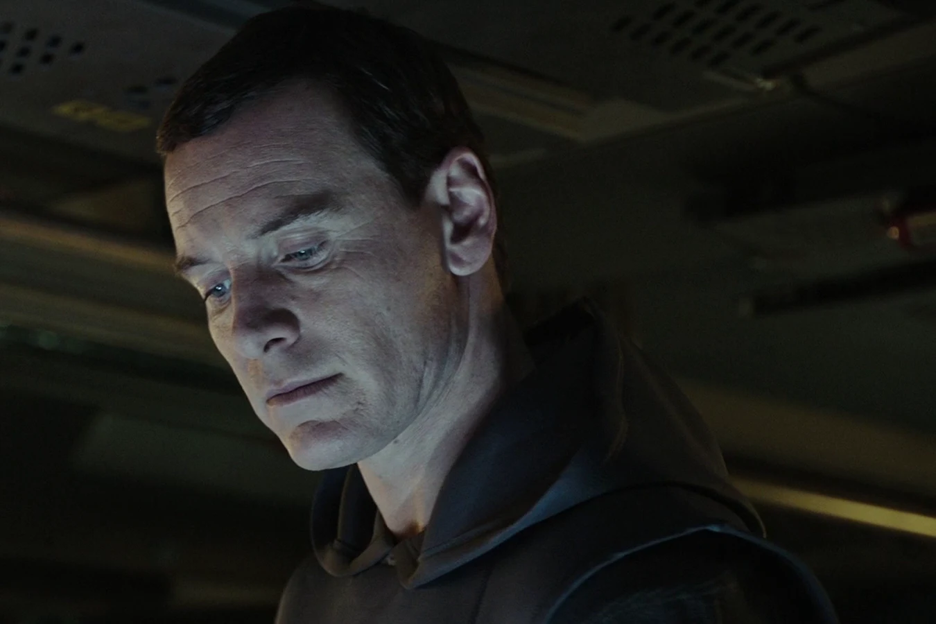Walter in a hooded suit, looking down aboard the Covenant