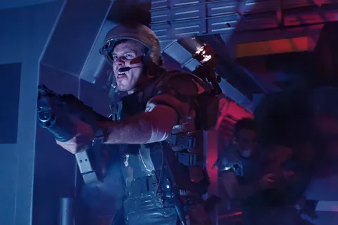 PFC William Hudson firing an M41A Pulse Rifle in a Hadley's Hope corridor in Aliens