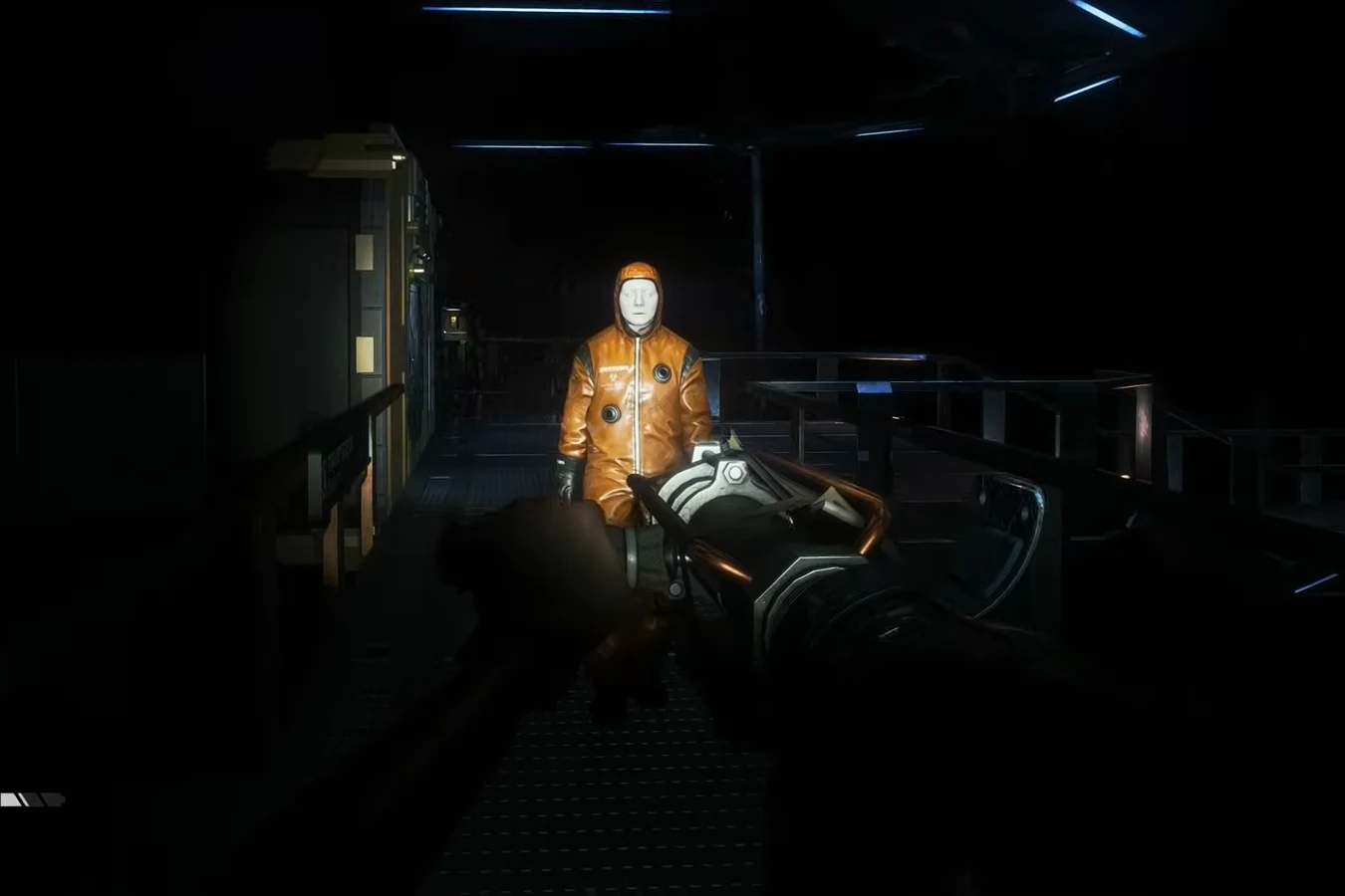 Amanda Ripley aiming a bolt gun at a hazmat-suited Working Joe on Sevastopol Station