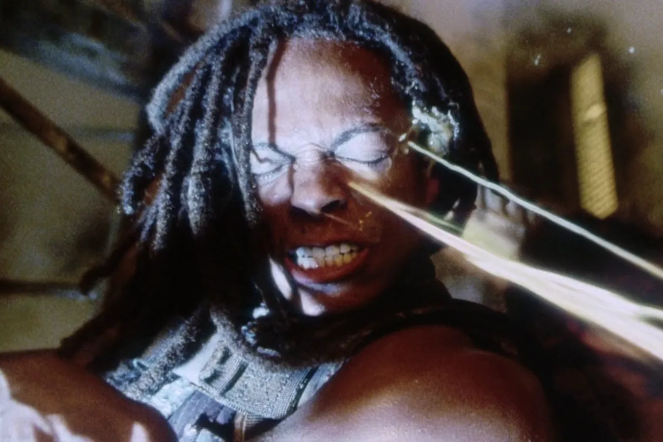 The Cloned Xenomorph Warrior from Alien: Resurrection spits acid into the face of Christie
