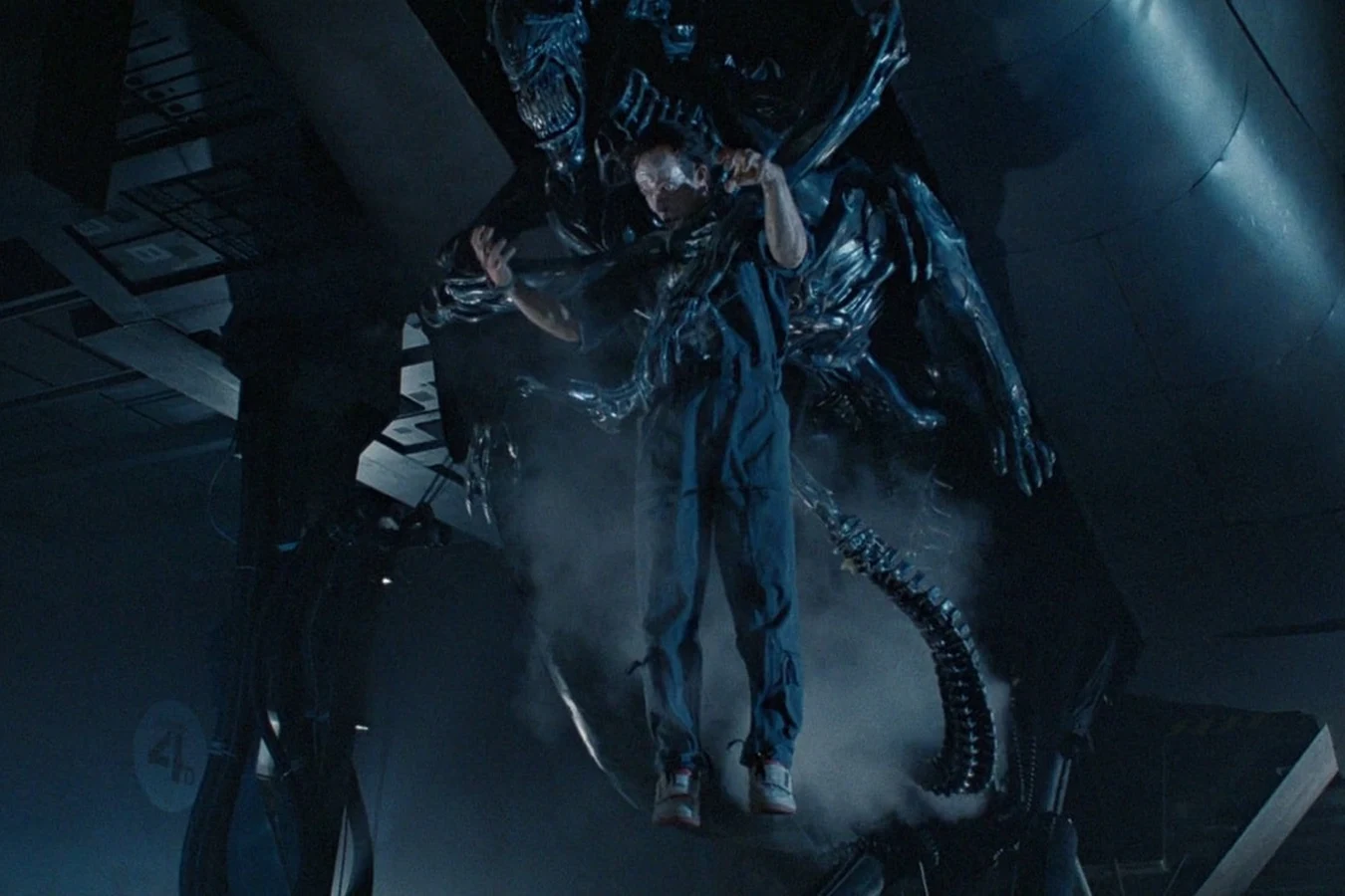 The Xenomorph Queen attacks Bishop aboard the Sulaco in Aliens