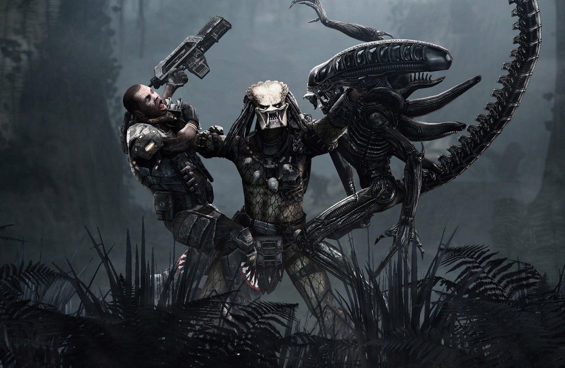 A Predator lifting both a Colonial Marine and a Xenomorph, showing its strength