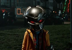 A Human Child with a Predator Mask