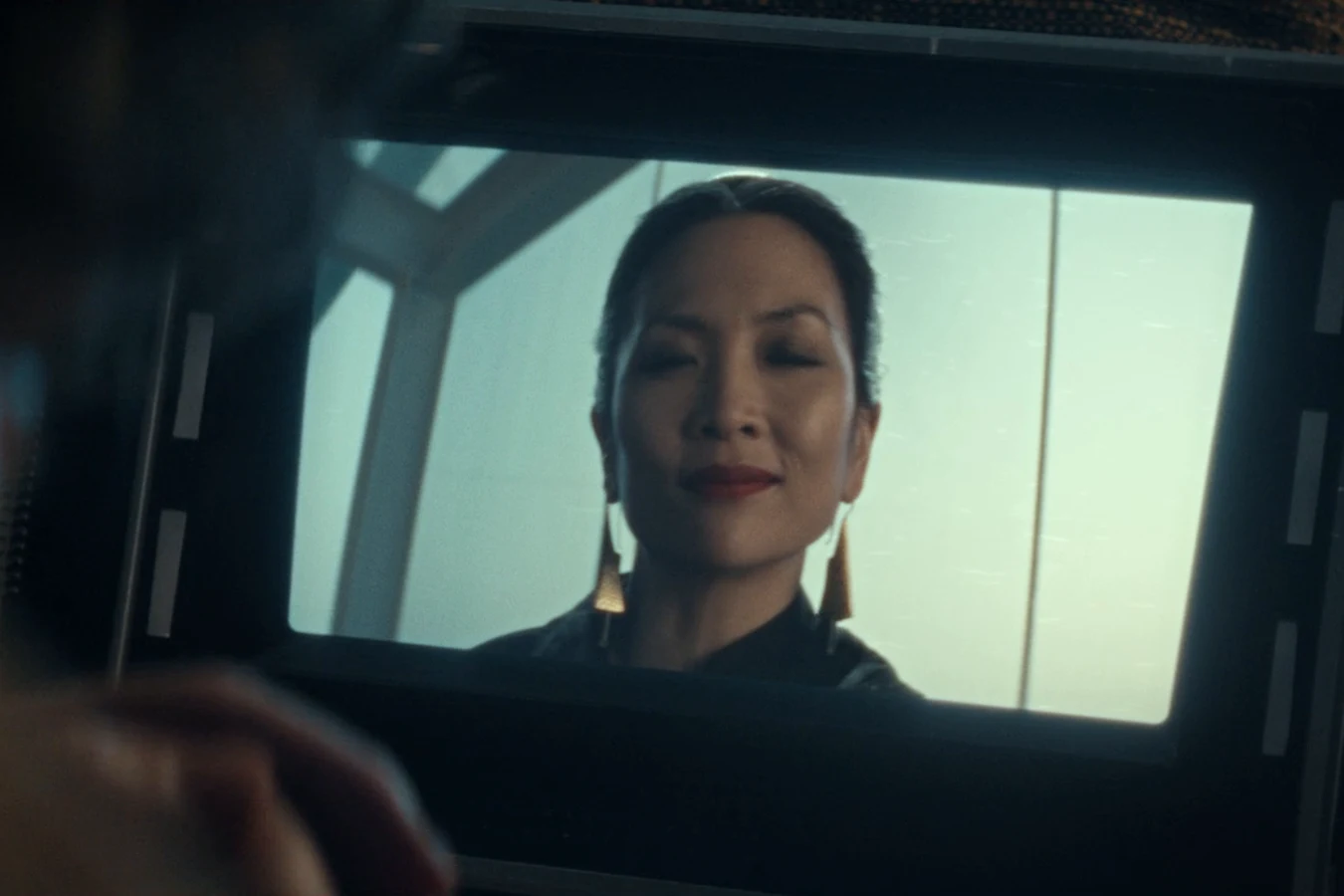 Yutani on the screen of a handheld video device during her call with Boy Kavalier in Alien: Earth