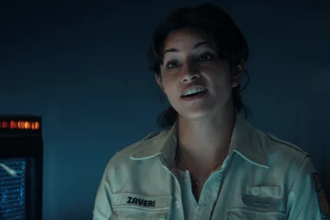 Zoya Zaveri in her Maginot uniform with a ZAVERI name tape, speaking beside a navigation screen in Alien: Earth